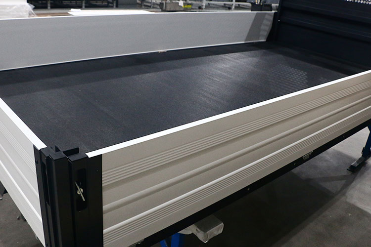 Thermoplastic non-slip honeycomb panels for truck floors